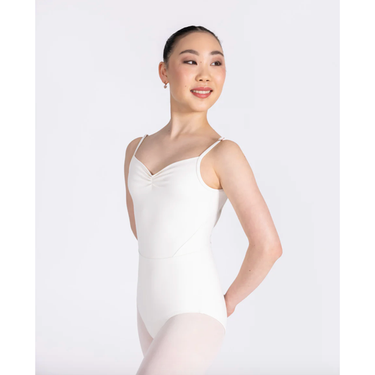 Dancer is wearing a pearl coloured Odette leotard which features a sweetheart pleated neckline, supportive double back strap and detailed bodice