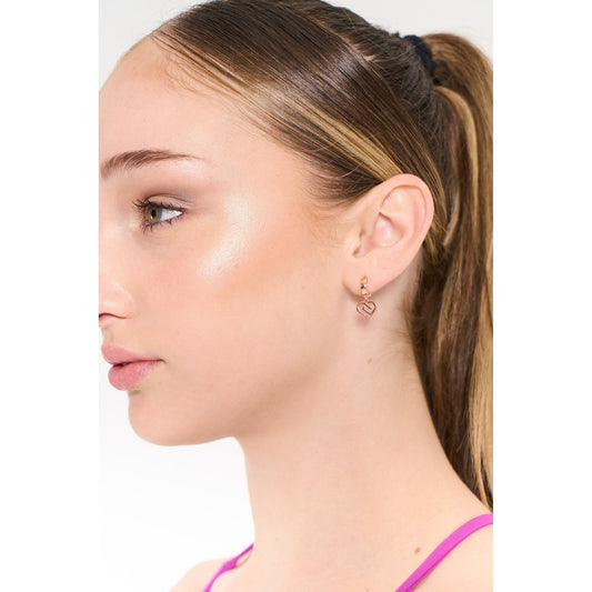 Dancer is wearing CDW rose coloured charm drop earings