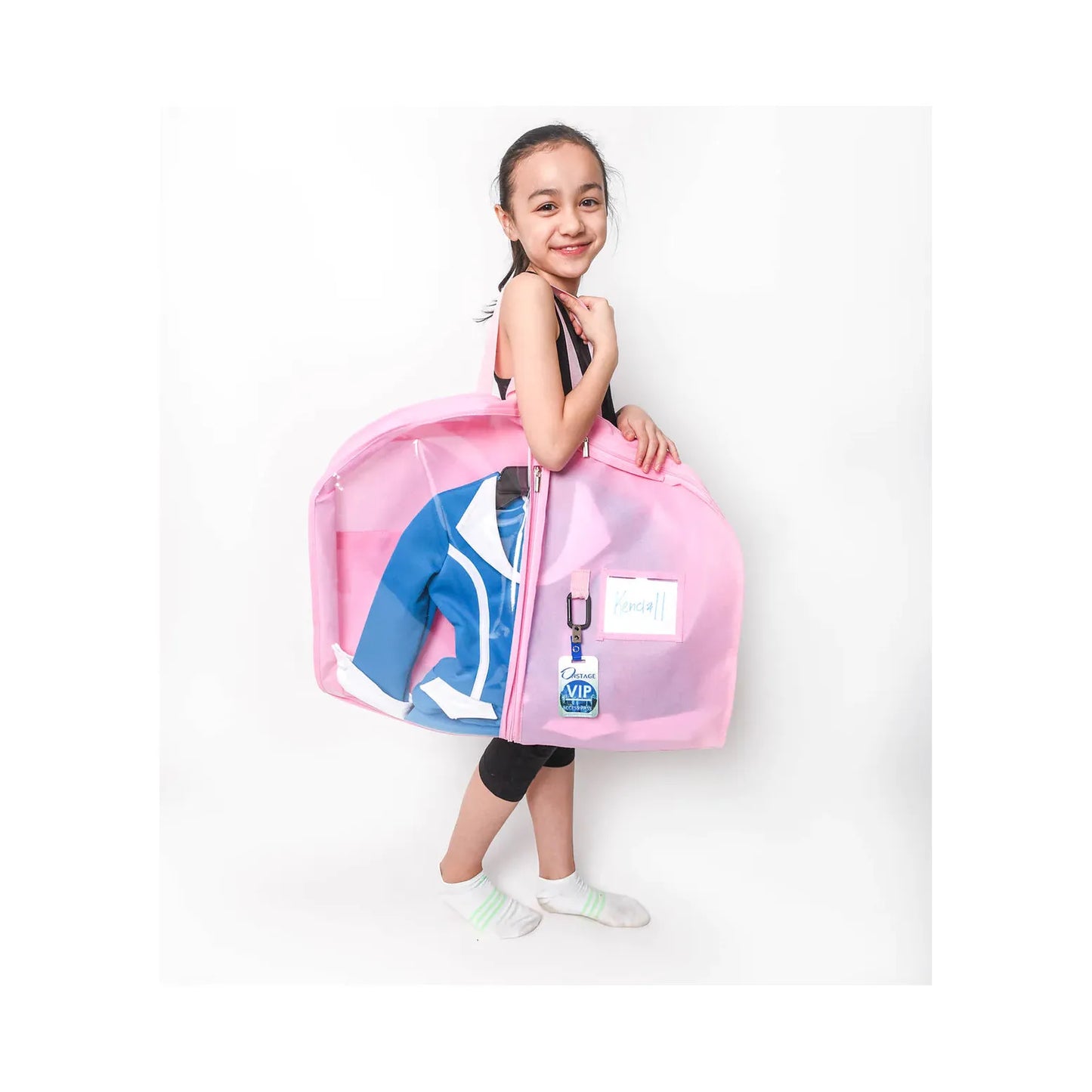 Dancer holding cotton candy (pink) coloured garment bag with clear pockets