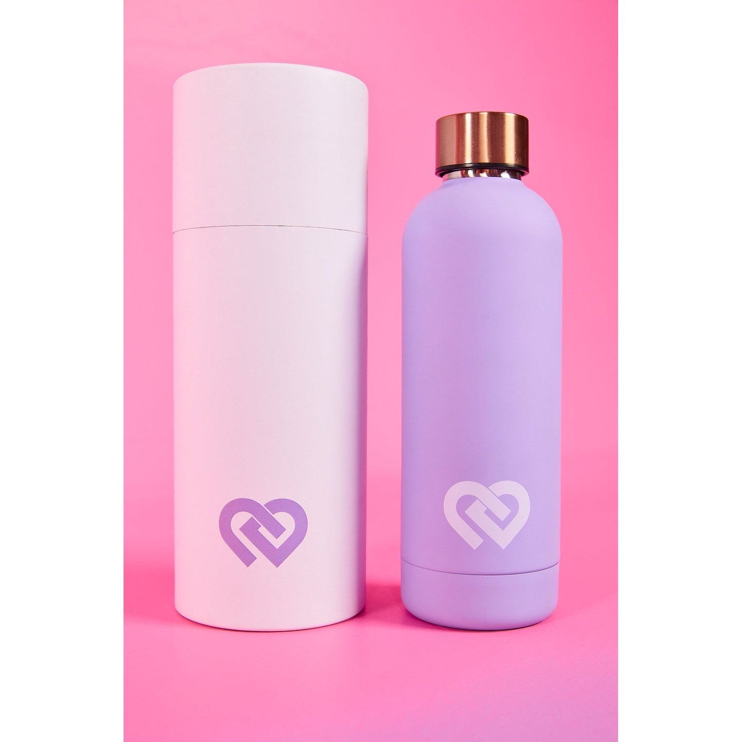 A picture of a lilac coloured CDW water bottle featuring a leak and spill proof rose gold lid