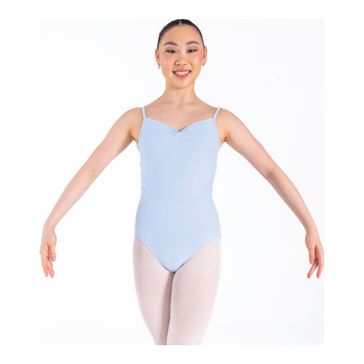 Dancer is wearing an ice blue Odette leotard which features a sweetheart pleated neckline, supportive double back strap and detailed bodice