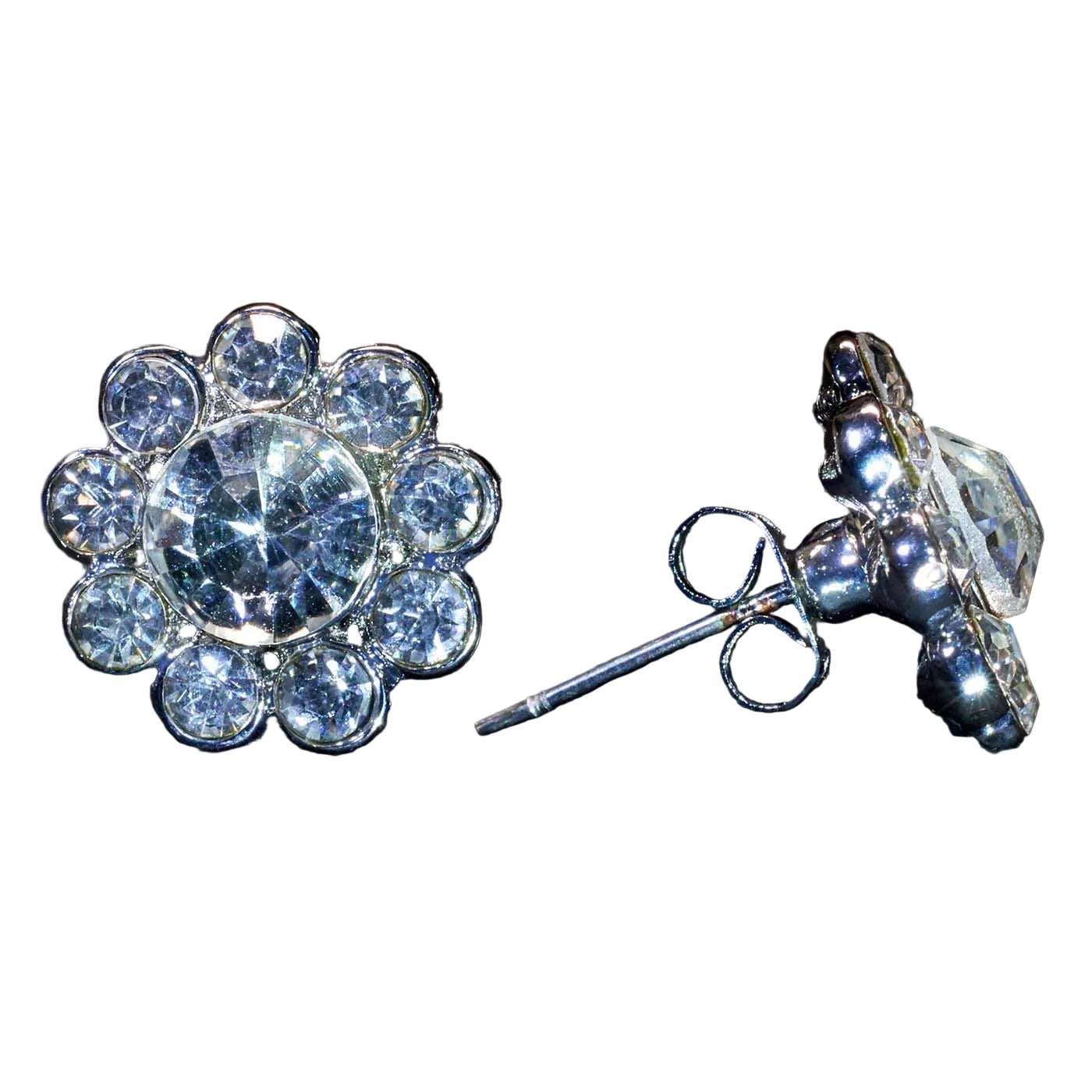 A pair of silver-toned floral stud earrings with clear round-cut stones, shown on a black textured background. One earring is facing forward, and the other is turned to show the post and butterfly back.