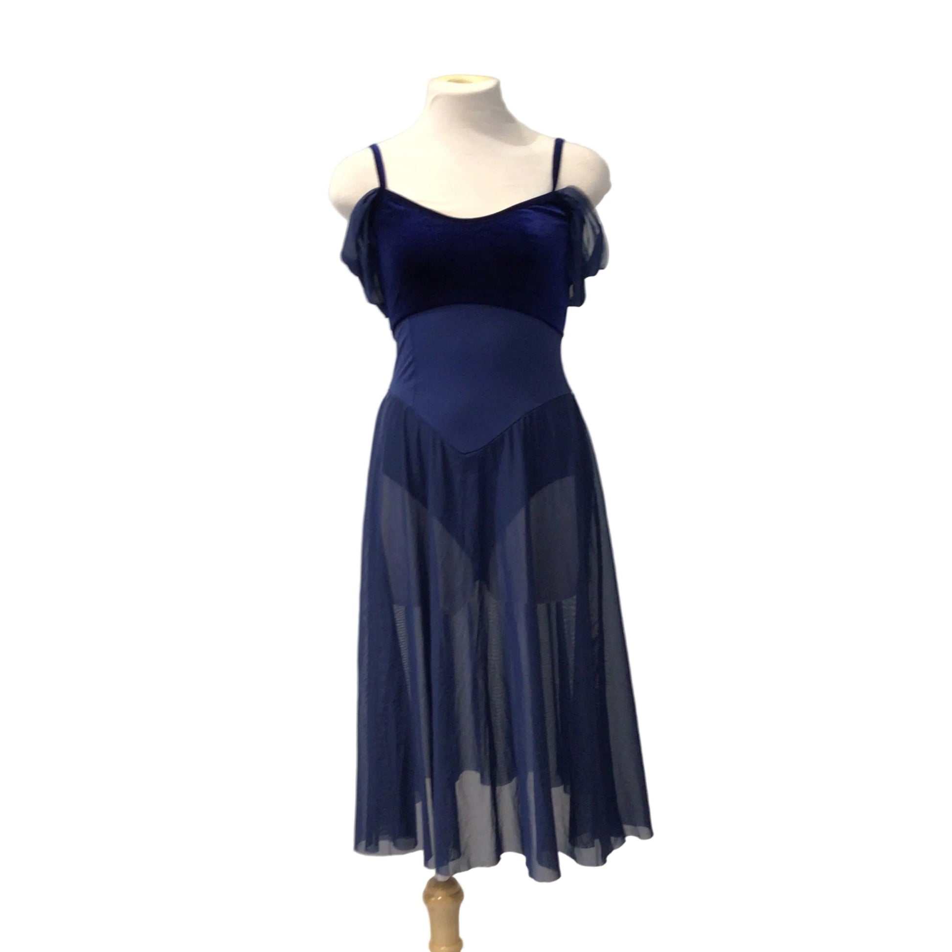 A navy blue sleeveless evening gown displayed on a mannequin torso against a white paneled wall.
