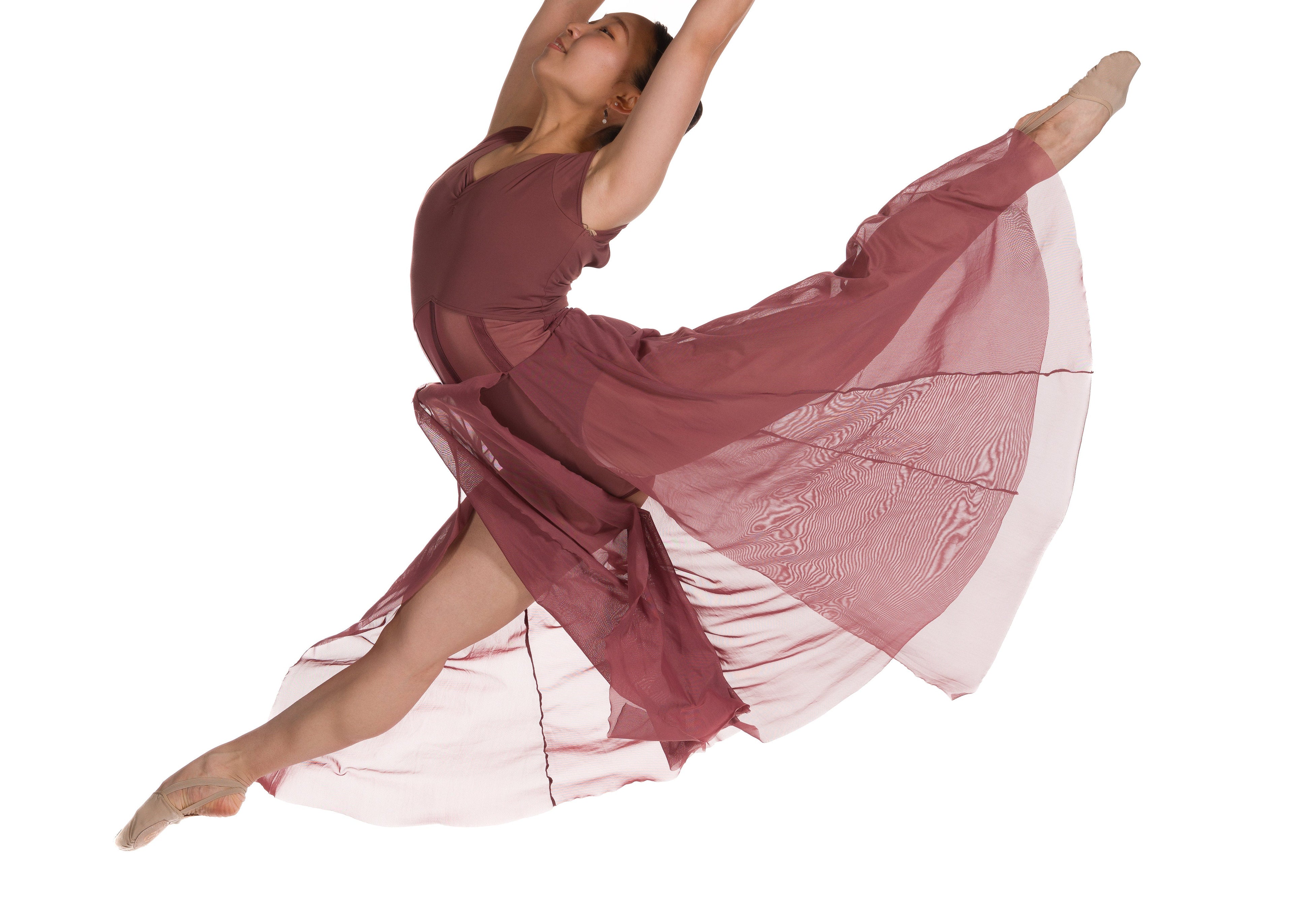 Dancer in a flowing dress on a white background