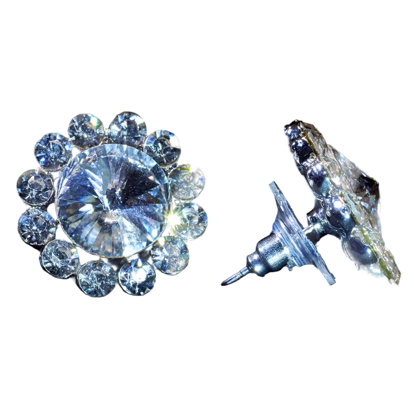 A pair of silver-toned crystal stud earrings with a large round clear center stone surrounded by a halo of smaller clear stones, shown on a black background. One earring is facing forward and the other is turned to show the post and backing.