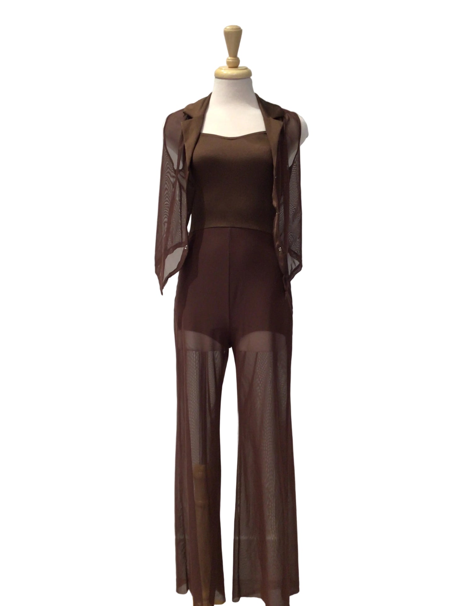 A brown sheer mesh two-piece outfit, consisting of a long-sleeve cropped jacket and matching wide-leg pants, displayed on a mannequin torso against a white paneled wall.